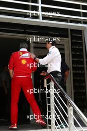 Team principals 'meeting to discuss about the qualifying system. Toto Wolff (GER) Mercedes AMG F1 Shareholder and Executive Director and Maurizio Arrivabene (ITA), Team Principal, Scuderia Ferrari  03.04.2016. Formula 1 World Championship, Rd 2, Bahrain Grand Prix, Sakhir, Bahrain, Race Day.