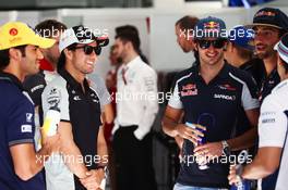 Sergio Perez (MEX) Sahara Force India F1 and Carlos Sainz Jr (ESP) Scuderia Toro Rosso on the drivers parade. 03.04.2016. Formula 1 World Championship, Rd 2, Bahrain Grand Prix, Sakhir, Bahrain, Race Day.