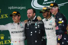 The podium (L to R): Nico Rosberg (GER) Mercedes AMG F1, second; Bradley Lord (GBR) Mercedes AMG F1 Communications Manager; Lewis Hamilton (GBR) Mercedes AMG F1, race winner; Max Verstappen (NLD) Red Bull Racing, third. 13.11.2016. Formula 1 World Championship, Rd 20, Brazilian Grand Prix, Sao Paulo, Brazil, Race Day.