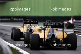 Kevin Magnussen (DEN) Renault Sport F1 Team RS16 and Jolyon Palmer (GBR) Renault Sport F1 Team RS16 at the end of the pit lane. 12.11.2016. Formula 1 World Championship, Rd 20, Brazilian Grand Prix, Sao Paulo, Brazil, Qualifying Day.