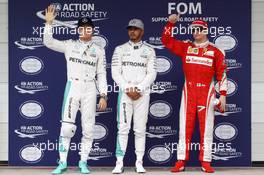 Qualifying top three in parc ferme (L to R): Nico Rosberg (GER) Mercedes AMG F1, second; Lewis Hamilton (GBR) Mercedes AMG F1, pole position; Kimi Raikkonen (FIN) Ferrari, third. 12.11.2016. Formula 1 World Championship, Rd 20, Brazilian Grand Prix, Sao Paulo, Brazil, Qualifying Day.