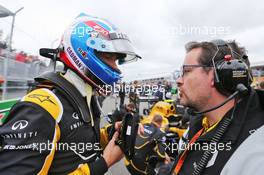 (L to R): Jolyon Palmer (GBR) Renault Sport F1 Team with Julien Simon-Chautemps (FRA) Renault Sport F1 Team Race Engineer on the grid. 12.06.2016. Formula 1 World Championship, Rd 7, Canadian Grand Prix, Montreal, Canada, Race Day.