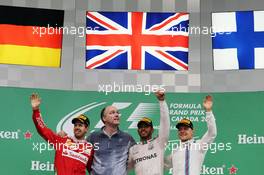 The podium (L to R): Sebastian Vettel (GER) Ferrari, second; Lewis Hamilton (GBR) Mercedes AMG F1, race winner; Valtteri Bottas (FIN) Williams, third. 12.06.2016. Formula 1 World Championship, Rd 7, Canadian Grand Prix, Montreal, Canada, Race Day.