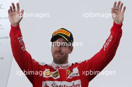 Sebastian Vettel (GER) Ferrari celebrates his second position on the podium. 12.06.2016. Formula 1 World Championship, Rd 7, Canadian Grand Prix, Montreal, Canada, Race Day.