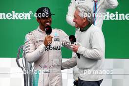 (L to R): race winner Lewis Hamilton (GBR) Mercedes AMG F1 with Michael Douglas (USA) Actor on the podium. 12.06.2016. Formula 1 World Championship, Rd 7, Canadian Grand Prix, Montreal, Canada, Race Day.