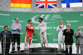 The podium (L to R): Sebastian Vettel (GER) Ferrari, second; Lewis Hamilton (GBR) Mercedes AMG F1, race winner; Valtteri Bottas (FIN) Williams, third. 12.06.2016. Formula 1 World Championship, Rd 7, Canadian Grand Prix, Montreal, Canada, Race Day.