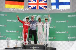 The podium (L to R): Sebastian Vettel (GER) Ferrari, second; Lewis Hamilton (GBR) Mercedes AMG F1, race winner; Valtteri Bottas (FIN) Williams, third. 12.06.2016. Formula 1 World Championship, Rd 7, Canadian Grand Prix, Montreal, Canada, Race Day.