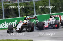 Sergio Perez (MEX) Sahara Force India F1 VJM09 and Romain Grosjean (FRA) Haas F1 Team VF-16 battle for position. 12.06.2016. Formula 1 World Championship, Rd 7, Canadian Grand Prix, Montreal, Canada, Race Day.