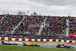 Marcus Ericsson (SWE) Sauber C35 leads Kevin Magnussen (DEN) Renault Sport F1 Team RS16 and Lewis Hamilton (GBR) Mercedes AMG F1 W07 Hybrid. 12.06.2016. Formula 1 World Championship, Rd 7, Canadian Grand Prix, Montreal, Canada, Race Day.