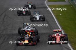 Max Verstappen (NLD) Red Bull Racing RB12 and Kimi Raikkonen (FIN) Ferrari SF16-H battle for position. 12.06.2016. Formula 1 World Championship, Rd 7, Canadian Grand Prix, Montreal, Canada, Race Day.