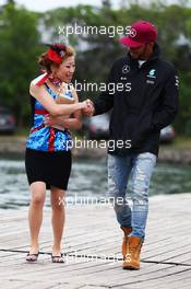 Lewis Hamilton (GBR) Mercedes AMG F1 with a fan. 11.06.2016. Formula 1 World Championship, Rd 7, Canadian Grand Prix, Montreal, Canada, Qualifying Day.