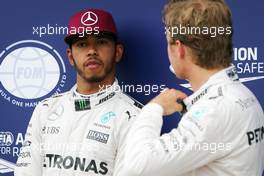 (L to R): Pole sitter Lewis Hamilton (GBR) Mercedes AMG F1 with second placed team mate Nico Rosberg (GER) Mercedes AMG F1  in qualifying parc ferme. 11.06.2016. Formula 1 World Championship, Rd 7, Canadian Grand Prix, Montreal, Canada, Qualifying Day.