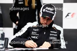 Sergio Perez (MEX) Sahara Force India F1 signs autographs for the fans. 09.06.2016. Formula 1 World Championship, Rd 7, Canadian Grand Prix, Montreal, Canada, Preparation Day.