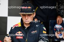 Max Verstappen (NLD) Red Bull Racing signs autographs for the fans. 09.06.2016. Formula 1 World Championship, Rd 7, Canadian Grand Prix, Montreal, Canada, Preparation Day.