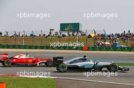 Lewis Hamilton (GBR) Mercedes AMG F1 W07 Hybrid and Kimi Raikkonen (FIN) Ferrari SF16-H battle for position. 17.04.2016. Formula 1 World Championship, Rd 3, Chinese Grand Prix, Shanghai, China, Race Day.