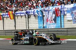 Nico Hulkenberg (GER) Sahara Force India F1 VJM09 and Esteban Gutierrez (MEX) Haas F1 Team VF-16 battle for position. 17.04.2016. Formula 1 World Championship, Rd 3, Chinese Grand Prix, Shanghai, China, Race Day.