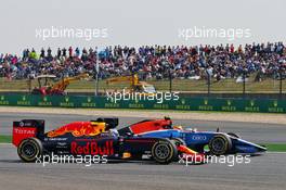 Daniel Ricciardo (AUS) Red Bull Racing RB12 and Rio Haryanto (IDN) Manor Racing MRT05. 17.04.2016. Formula 1 World Championship, Rd 3, Chinese Grand Prix, Shanghai, China, Race Day.