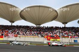 Romain Grosjean (FRA) Haas F1 Team VF-16 leads Lewis Hamilton (GBR) Mercedes AMG F1 W07 Hybrid. 17.04.2016. Formula 1 World Championship, Rd 3, Chinese Grand Prix, Shanghai, China, Race Day.