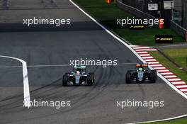 (L to R): Lewis Hamilton (GBR) Mercedes AMG F1 W07 Hybrid and Nico Hulkenberg (GER) Sahara Force India F1 VJM09 battle for position. 17.04.2016. Formula 1 World Championship, Rd 3, Chinese Grand Prix, Shanghai, China, Race Day.