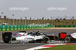 Valtteri Bottas (FIN) Williams FW38 and Sergio Perez (MEX) Sahara Force India F1 VJM09 battle for position. 17.04.2016. Formula 1 World Championship, Rd 3, Chinese Grand Prix, Shanghai, China, Race Day.