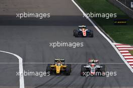 (L to R): Jolyon Palmer (GBR) Renault Sport F1 Team RS16 battle for position with Esteban Gutierrez (MEX) Haas F1 Team VF-16. 17.04.2016. Formula 1 World Championship, Rd 3, Chinese Grand Prix, Shanghai, China, Race Day.