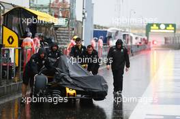 An Renault Sport F1 Team RS16 is pushed down a wet and rainy pits. 16.04.2016. Formula 1 World Championship, Rd 3, Chinese Grand Prix, Shanghai, China, Qualifying Day.