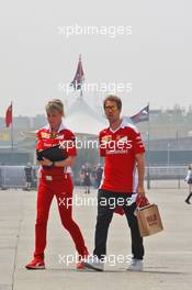 Sebastian Vettel (GER) Ferrari with Britta Roeske (AUT) Ferrari Press Officer. 14.04.2016. Formula 1 World Championship, Rd 3, Chinese Grand Prix, Shanghai, China, Preparation Day.
