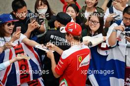 Sebastian Vettel (GER) Ferrari signs autographs for the fans. 14.04.2016. Formula 1 World Championship, Rd 3, Chinese Grand Prix, Shanghai, China, Preparation Day.