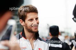 Romain Grosjean (FRA) Haas F1 Team signs autographs for the fans. 14.04.2016. Formula 1 World Championship, Rd 3, Chinese Grand Prix, Shanghai, China, Preparation Day.