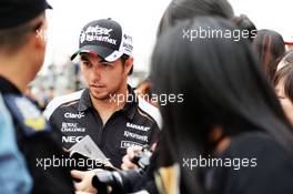 Sergio Perez (MEX) Sahara Force India F1 signs autographs for the fans. 14.04.2016. Formula 1 World Championship, Rd 3, Chinese Grand Prix, Shanghai, China, Preparation Day.