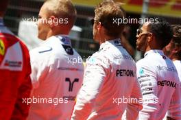 Nico Rosberg (GER) Mercedes AMG F1 and Lewis Hamilton (GBR) Mercedes AMG F1 as the grid observes the national anthem. 15.05.2016. Formula 1 World Championship, Rd 5, Spanish Grand Prix, Barcelona, Spain, Race Day.