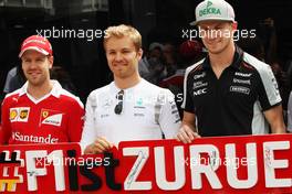 (L to R): Sebastian Vettel (GER) Ferrari; Nico Rosberg (GER) Mercedes AMG F1; and Nico Hulkenberg (GER) Sahara Force India F1, promote the return of the German Grand Prix. 12.05.2016. Formula 1 World Championship, Rd 5, Spanish Grand Prix, Barcelona, Spain, Preparation Day.