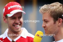 (L to R): Sebastian Vettel (GER) Ferrari with Nico Rosberg (GER) Mercedes AMG F1. 12.05.2016. Formula 1 World Championship, Rd 5, Spanish Grand Prix, Barcelona, Spain, Preparation Day.