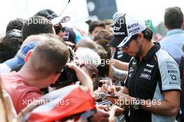 Sergio Perez (MEX) Sahara Force India F1 signs autographs for the fans. 12.05.2016. Formula 1 World Championship, Rd 5, Spanish Grand Prix, Barcelona, Spain, Preparation Day.