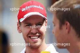 (L to R): Sebastian Vettel (GER) Ferrari with Nico Rosberg (GER) Mercedes AMG F1. 12.05.2016. Formula 1 World Championship, Rd 5, Spanish Grand Prix, Barcelona, Spain, Preparation Day.