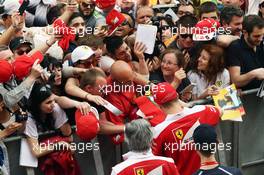 Kimi Raikkonen (FIN) Ferrari signs autographs for the fans. 12.05.2016. Formula 1 World Championship, Rd 5, Spanish Grand Prix, Barcelona, Spain, Preparation Day.