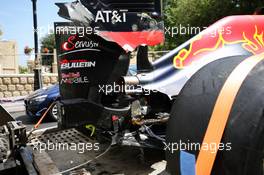 The damaged Red Bull Racing RB12 of Daniel Ricciardo (AUS) is recovered back to the pits on the back of a truck. 17.06.2016. Formula 1 World Championship, Rd 8, European Grand Prix, Baku Street Circuit, Azerbaijan, Practice Day.