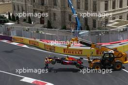 The Red Bull Racing RB12 of Daniel Ricciardo (AUS) Red Bull Racing is craned away after he crashed. 17.06.2016. Formula 1 World Championship, Rd 8, European Grand Prix, Baku Street Circuit, Azerbaijan, Practice Day.