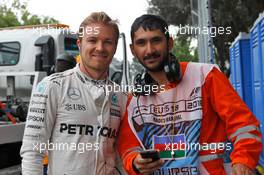 Nico Rosberg (GER) Mercedes AMG F1 with a marshal after he stopped in the second practice session. 17.06.2016. Formula 1 World Championship, Rd 8, European Grand Prix, Baku Street Circuit, Azerbaijan, Practice Day.
