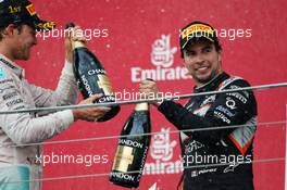 (L to R): Race winner Nico Rosberg (GER) Mercedes AMG F1 celebrates on the podium with third placed Sergio Perez (MEX) Sahara Force India F1. 19.06.2016. Formula 1 World Championship, Rd 8, European Grand Prix, Baku Street Circuit, Azerbaijan, Race Day.