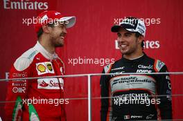 Sebastian Vettel (GER) Scuderia Ferrari SF16-H and Sergio Perez (MEX) Force India F1 VJM09. 19.06.2016. Formula 1 World Championship, Rd 8, European Grand Prix, Baku Street Circuit, Azerbaijan, Race Day.