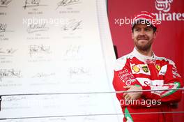 Sebastian Vettel (GER) Ferrari celebrates his second position on the podium. 19.06.2016. Formula 1 World Championship, Rd 8, European Grand Prix, Baku Street Circuit, Azerbaijan, Race Day.