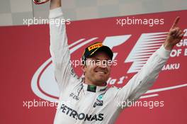 Race winner Nico Rosberg (GER) Mercedes AMG F1 celebrates on the podium. 19.06.2016. Formula 1 World Championship, Rd 8, European Grand Prix, Baku Street Circuit, Azerbaijan, Race Day.