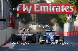 (L to R): Esteban Gutierrez (MEX) Haas F1 Team VF-16 and Felipe Nasr (BRA) Sauber C35 battle for position. 19.06.2016. Formula 1 World Championship, Rd 8, European Grand Prix, Baku Street Circuit, Azerbaijan, Race Day.