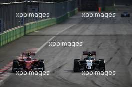 Kimi Raikkonen (FIN) Ferrari SF16-H and Nico Hulkenberg (GER) Sahara Force India F1 VJM09 battle for position. 19.06.2016. Formula 1 World Championship, Rd 8, European Grand Prix, Baku Street Circuit, Azerbaijan, Race Day.