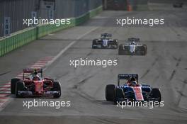 (L to R): Kimi Raikkonen (FIN) Ferrari SF16-H and Pascal Wehrlein (GER) Manor Racing MRT05 battle for position. 19.06.2016. Formula 1 World Championship, Rd 8, European Grand Prix, Baku Street Circuit, Azerbaijan, Race Day.