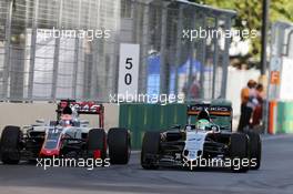 Nico Hulkenberg (GER) Sahara Force India F1 VJM09 and Romain Grosjean (FRA) Haas F1 Team VF-16 battle for position. 19.06.2016. Formula 1 World Championship, Rd 8, European Grand Prix, Baku Street Circuit, Azerbaijan, Race Day.