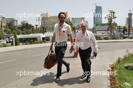 Bernie Ecclestone (GBR) with Matteo Bonciani (ITA) FIA Media Delegate. 18.06.2016. Formula 1 World Championship, Rd 8, European Grand Prix, Baku Street Circuit, Azerbaijan, Qualifying Day.