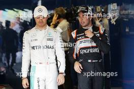 (L to R): Nico Rosberg (GER) Mercedes AMG F1 with Sergio Perez (MEX) Sahara Force India F1 in parc ferme. 18.06.2016. Formula 1 World Championship, Rd 8, European Grand Prix, Baku Street Circuit, Azerbaijan, Qualifying Day.