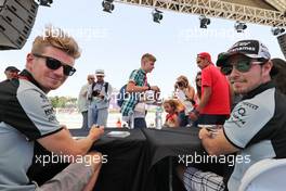 (L to R): Nico Hulkenberg (GER) Sahara Force India F1 and team mate Sergio Perez (MEX) Sahara Force India F1 sign autographs for the fans. 18.06.2016. Formula 1 World Championship, Rd 8, European Grand Prix, Baku Street Circuit, Azerbaijan, Qualifying Day.
